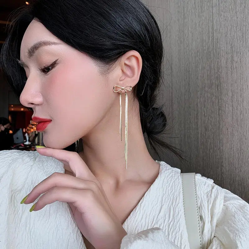 "2025 Classic Metal Bow Gold Tassel Drop Earrings"